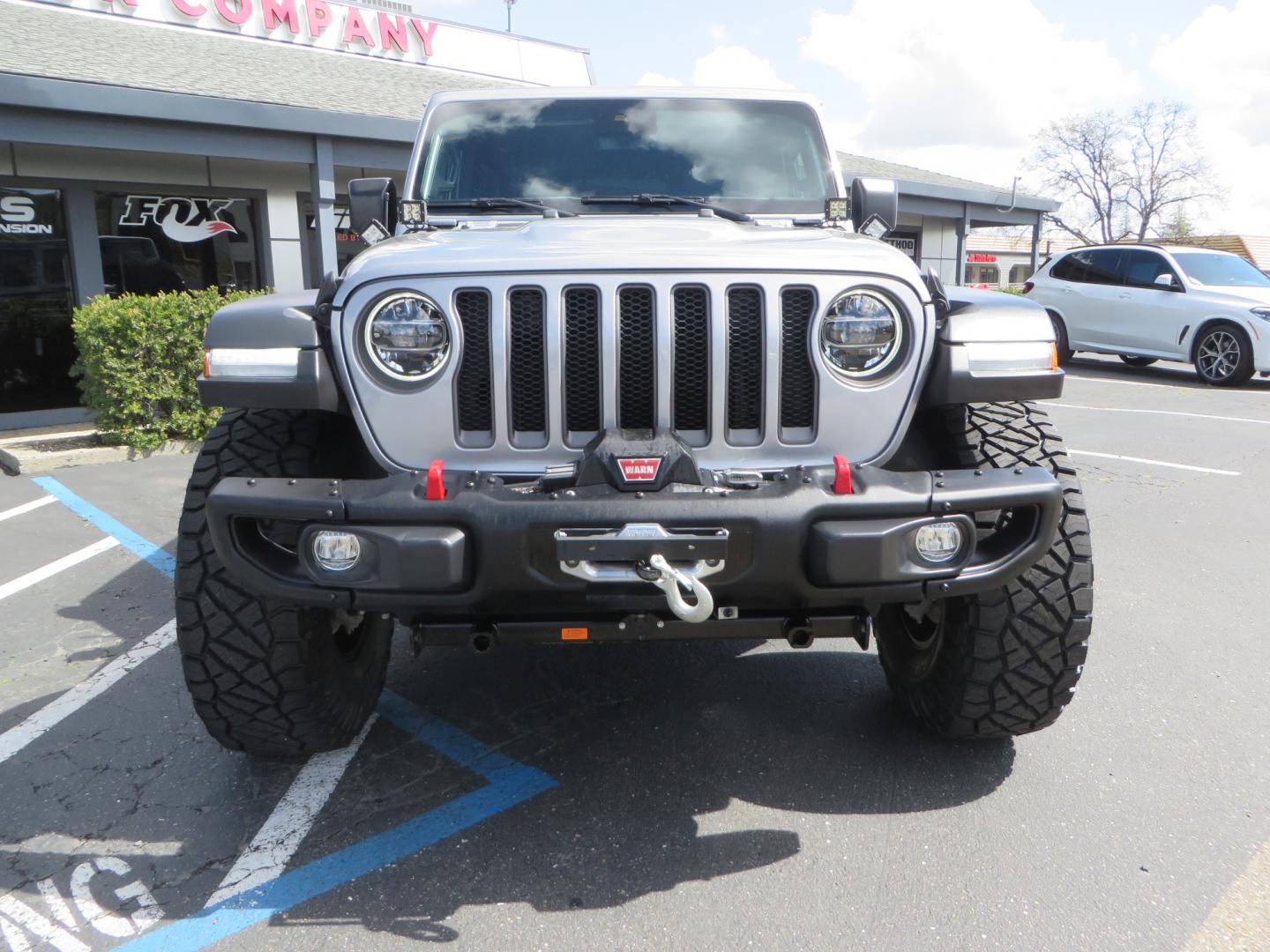 2021 SILVER /BLACK Jeep Wrangler Unlimited Rubicon (1C4HJXFG7MW) with an 3.6L V6 DOHC 24V FFV engine, 6A transmission, located at 2630 Grass Valley Highway, Auburn, CA, 95603, (530) 508-5100, 38.937893, -121.095482 - Features - Zone Offroad 3" Lift kit, Fox shocks, 37" Nitto Ridge Grappler tires, 17" Fuel Piston wheels, Warn winch, KC led lights, Voswitch switches, Teraflex HD tire relocation, Fire extinguisher, High Lift Jack, Shovel, Axe, Jumper Cables, and flat towable. - Photo#1